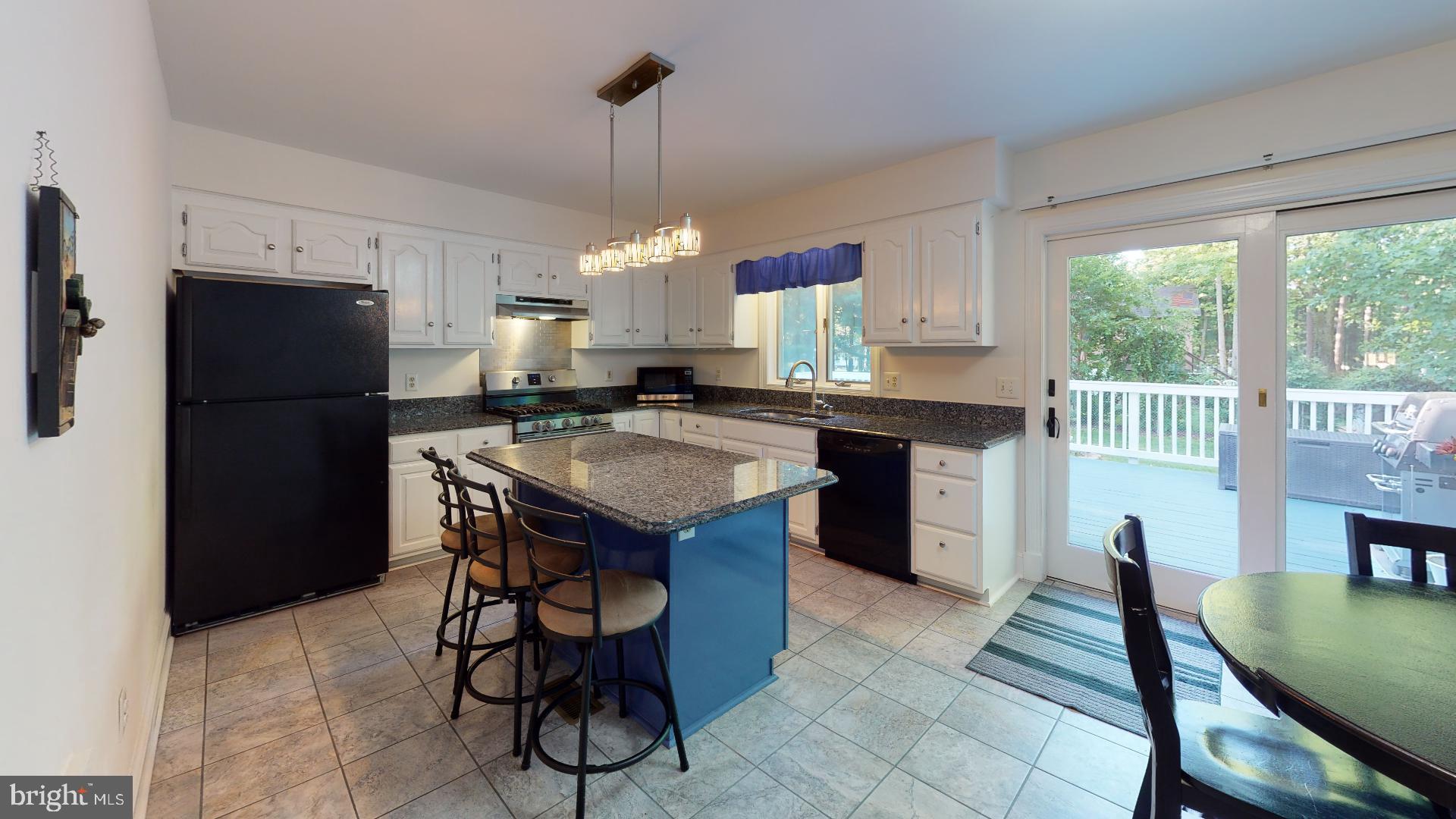 1055 Redeye Road Lusby, MD 20657 - Photo 6 of 38 Kitchen Opens to Deck