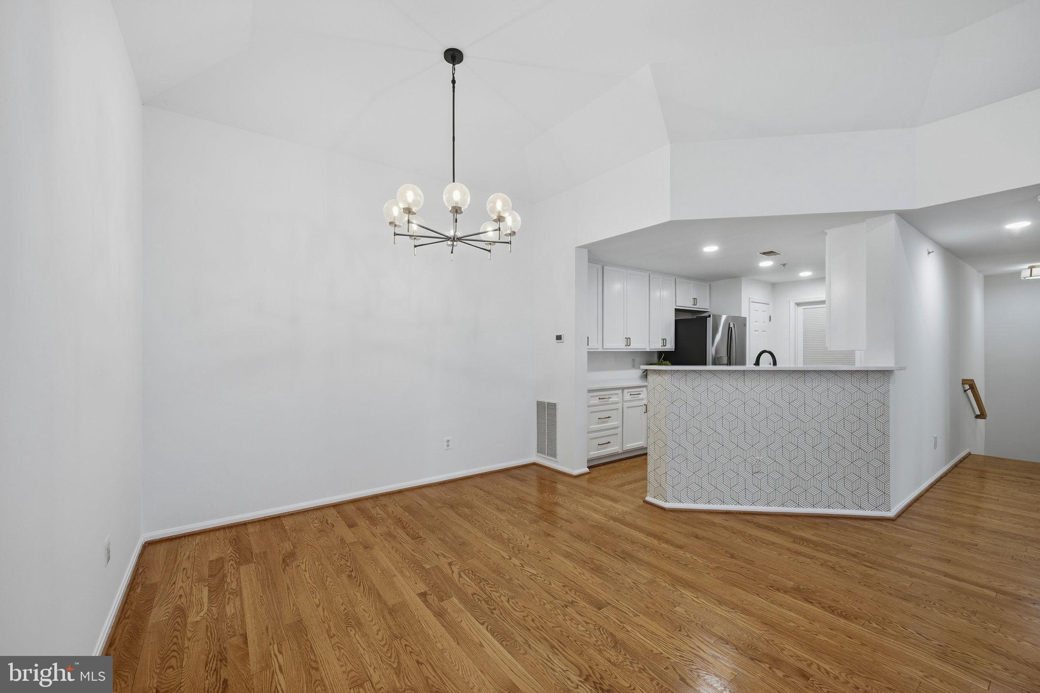 10793 Symphony Way, Unit 202 Columbia, MD 21044 - Photo 14 of 41 Dining connects to kitchen.