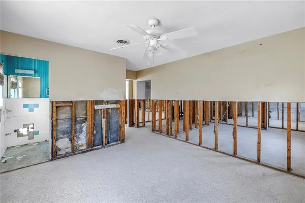 a bathroom with a toilet sink and shower curtain
