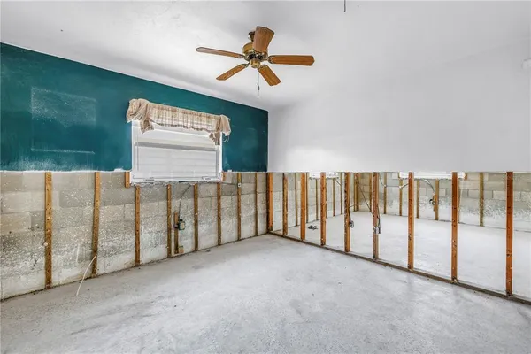 a view of a house with swimming pool and a yard