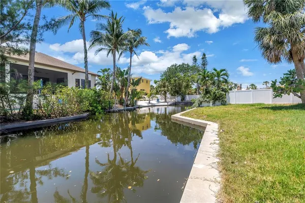 a house view with swimming pool and garden