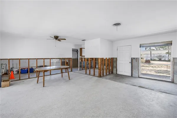 a view of a livingroom with furniture and a window