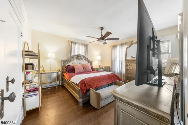 a spacious bedroom with a bed and a table