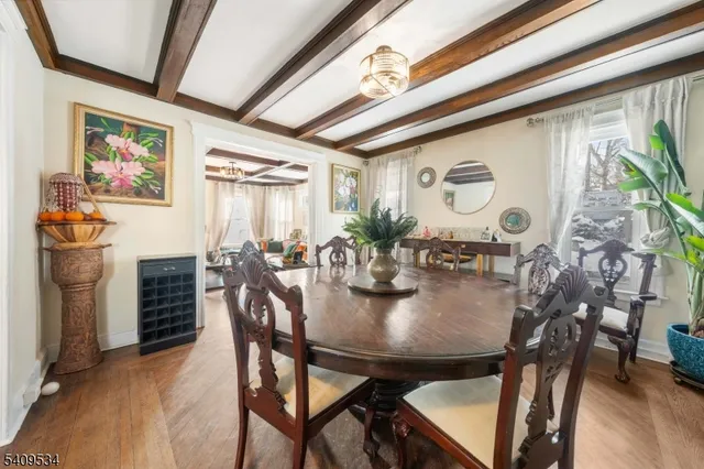 a view of a dining room with furniture and window
