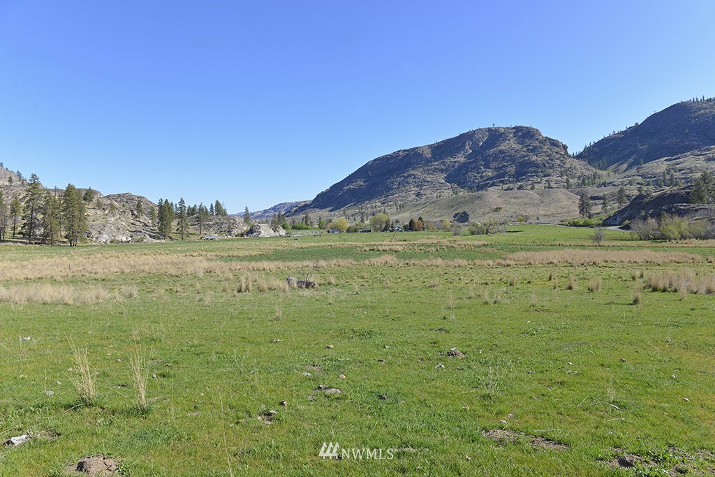 322 North End Omak Lake Road Omak, WA 98841 - Photo 39 of 40 a view of a field with an ocean