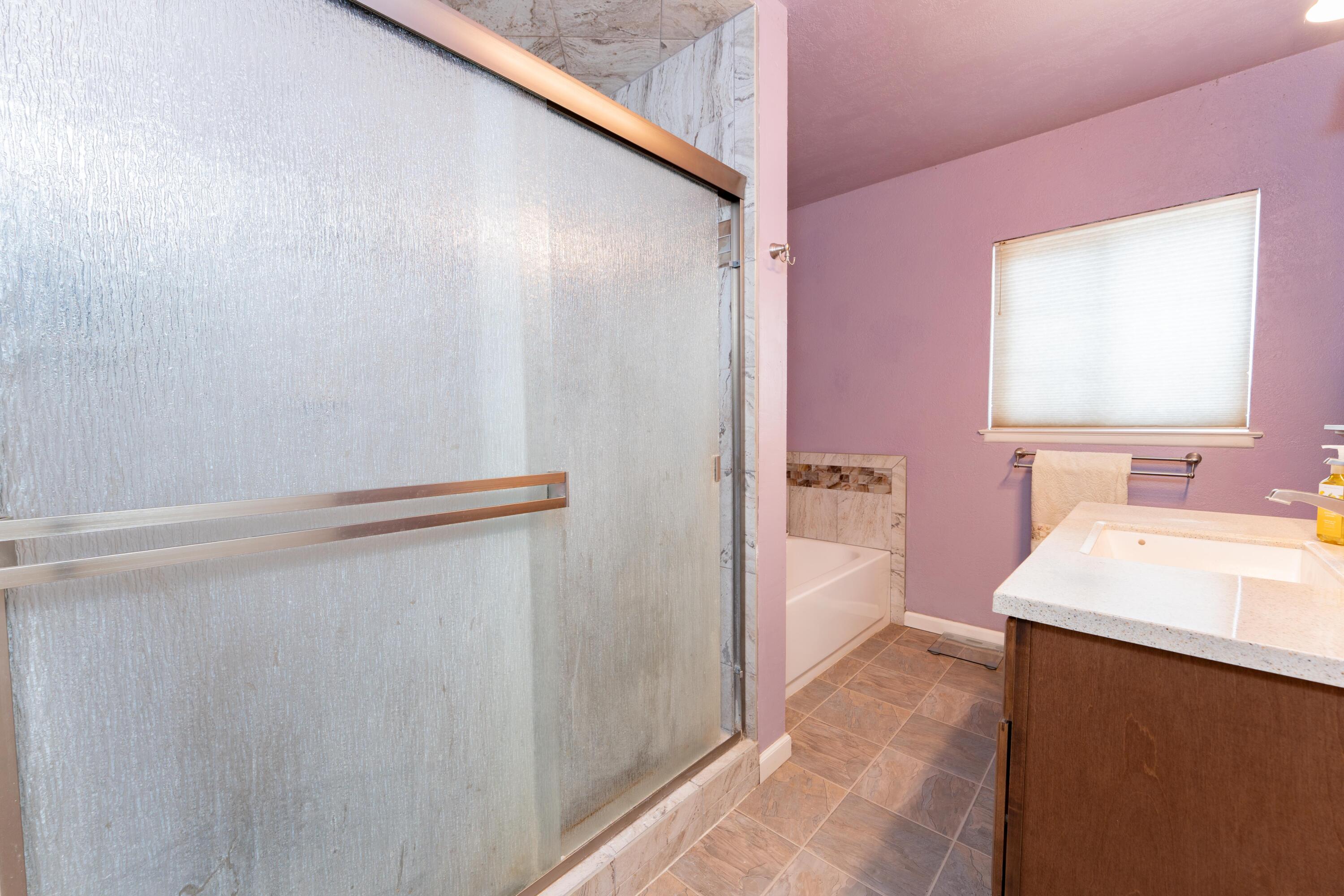 570 North Birch Avenue Reedley, CA 93654 - Photo 34 of 52 a bathroom with a sink a bath tub and a sink