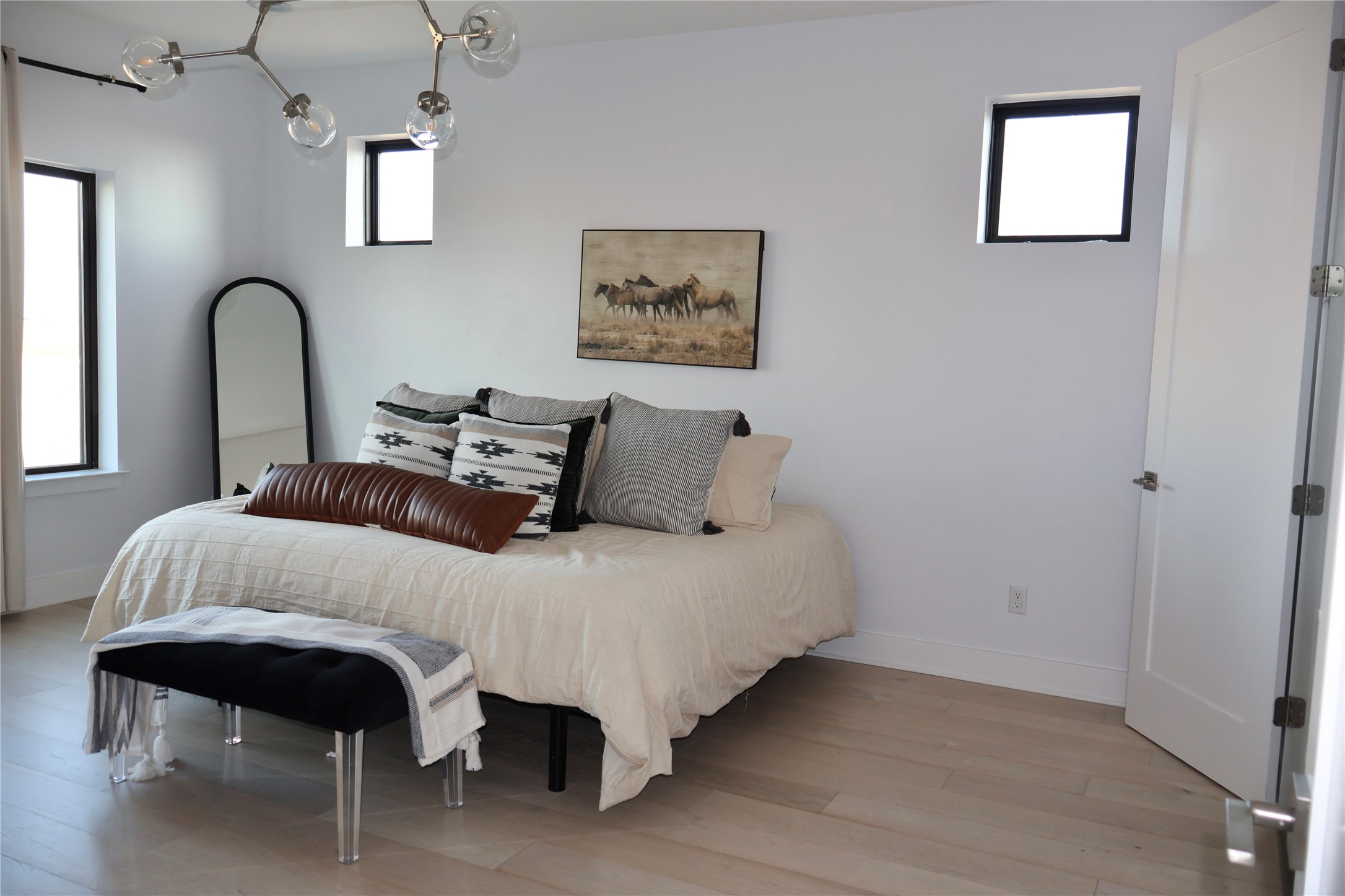 17216 Lund - Carlson Road Elgin, TX 78621 - Photo 6 of 17 Bedroom featuring light wood-style floors and baseboards