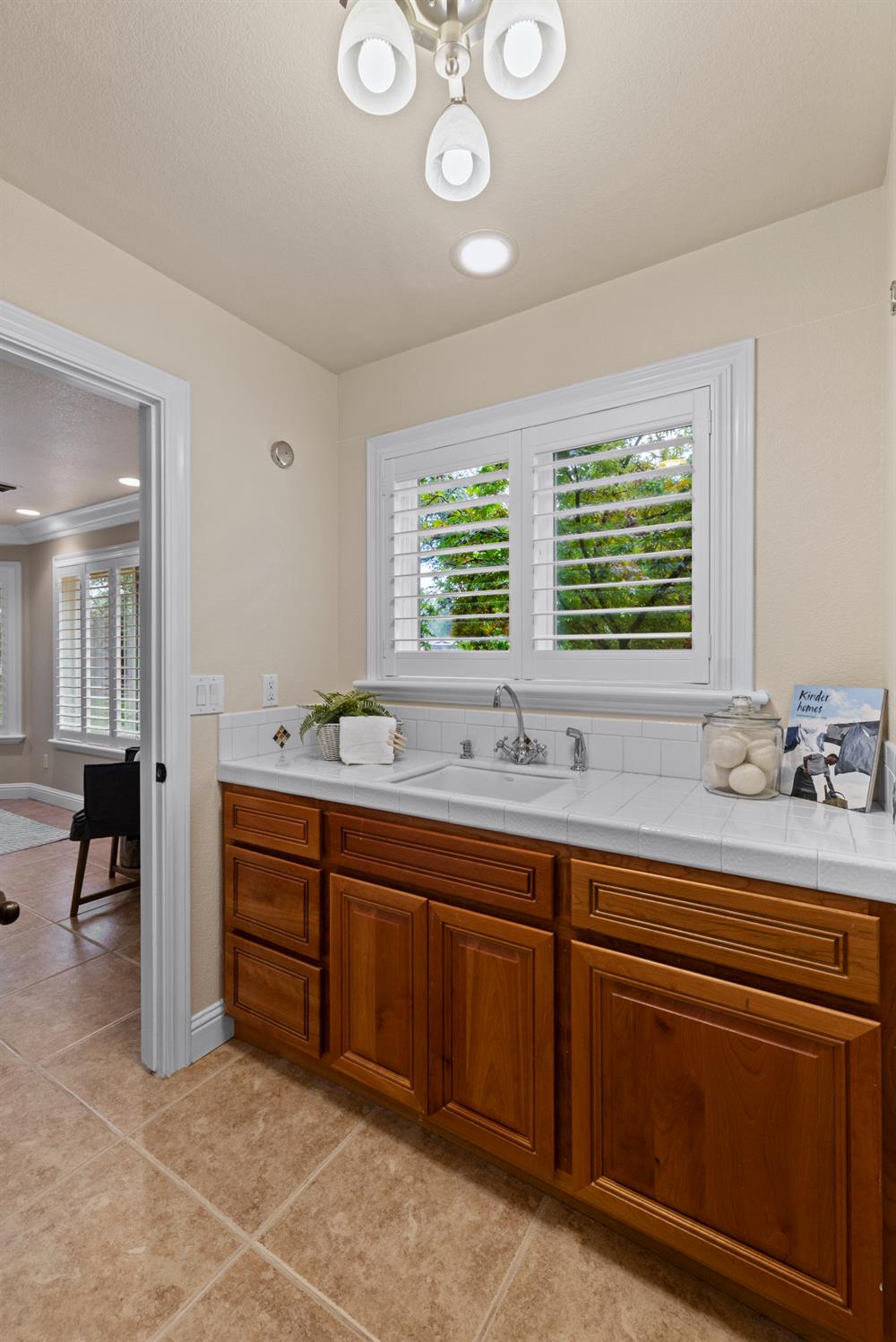 7396 Callison Road Penryn, CA 95663 - Photo 48 of 99 Sink in laundry room with built-in ironing board.
