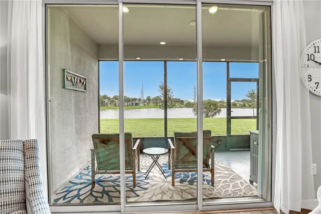 a view of a two chairs in the balcony