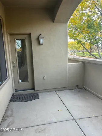 a view of a city and palm trees