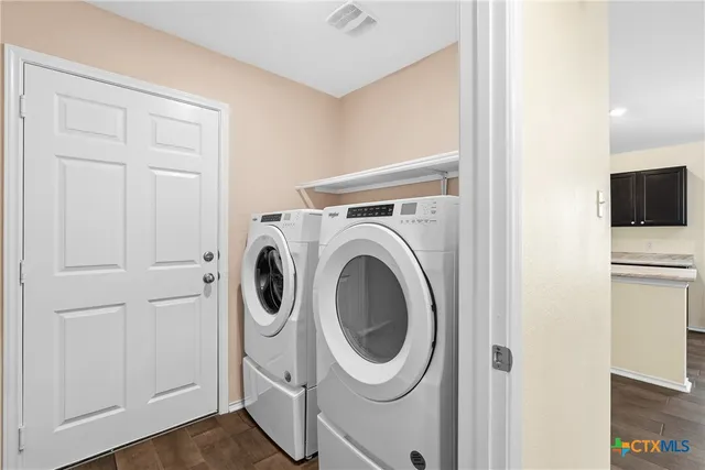 a utility room with dryer and washer