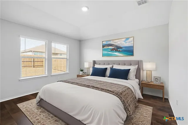 a bedroom with bed and a window