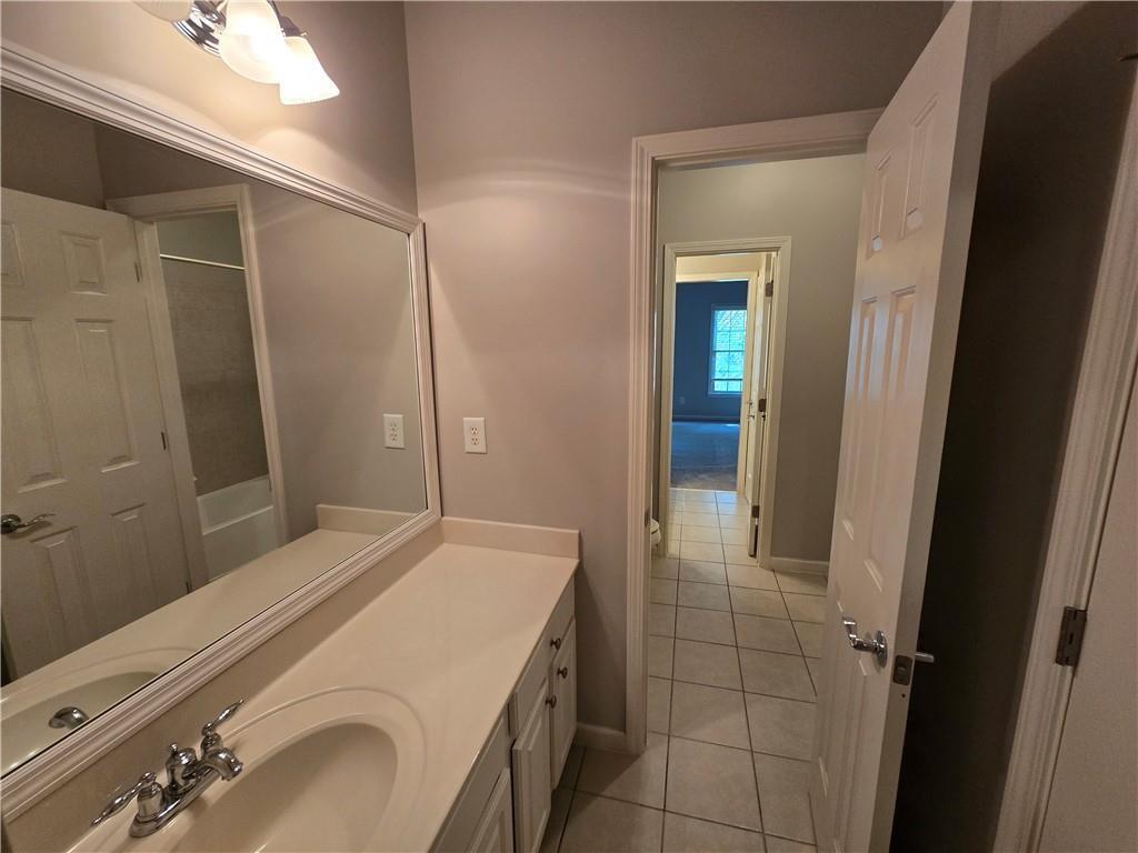624 Maple Grove Way Marietta, GA 30066 - Photo 20 of 27 a bathroom with a sink and a mirror