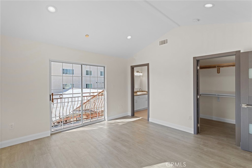 14957 Victory Boulevard, Unit 101 Van Nuys, CA 91411 - Photo 11 of 26 a view of an empty room with glass door