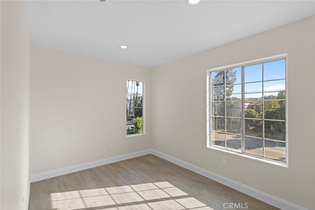 14957 Victory Boulevard, Unit 101 Van Nuys, CA 91411 - Photo 12 of 26 an empty room with windows