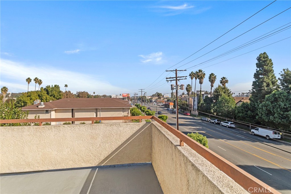 14957 Victory Boulevard, Unit 101 Van Nuys, CA 91411 - Photo 17 of 26 a view of a swimming pool with an outdoor seating
