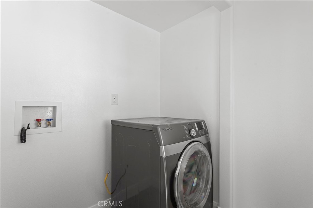 14957 Victory Boulevard, Unit 101 Van Nuys, CA 91411 - Photo 21 of 26 a utility room with dryer and washer