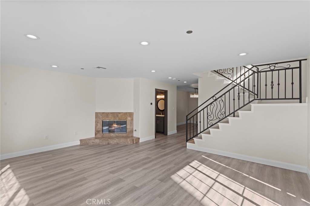 14957 Victory Boulevard, Unit 101 Van Nuys, CA 91411 - Photo 3 of 26 a view of a hallway with wooden floor