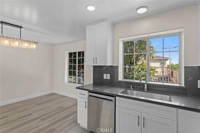 a kitchen with a sink and a window