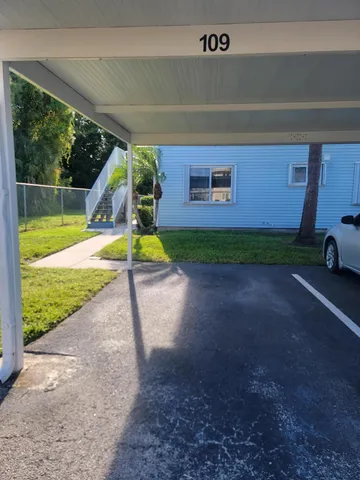 a view of a backyard with furniture