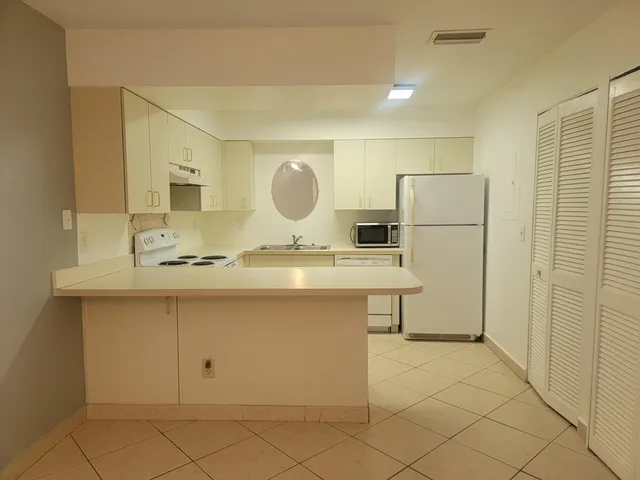 a bathroom with a sink a mirror and a shower