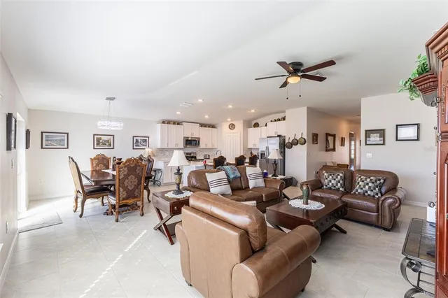 a bedroom with a bed chair and a window