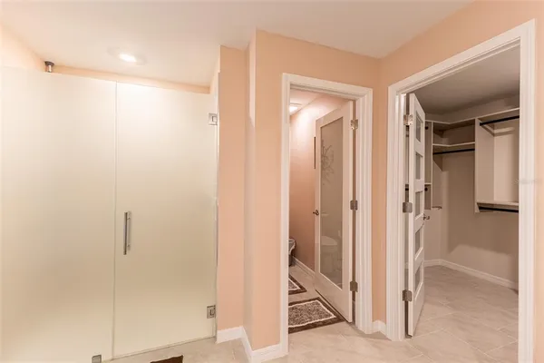 a bathroom with a toilet a sink and a shower