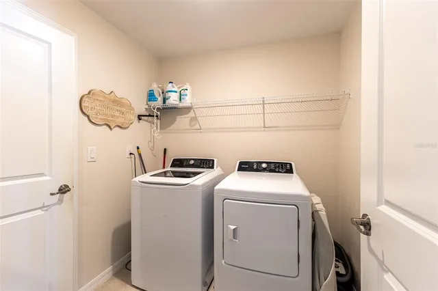 a view of a livingroom with furniture and shoes