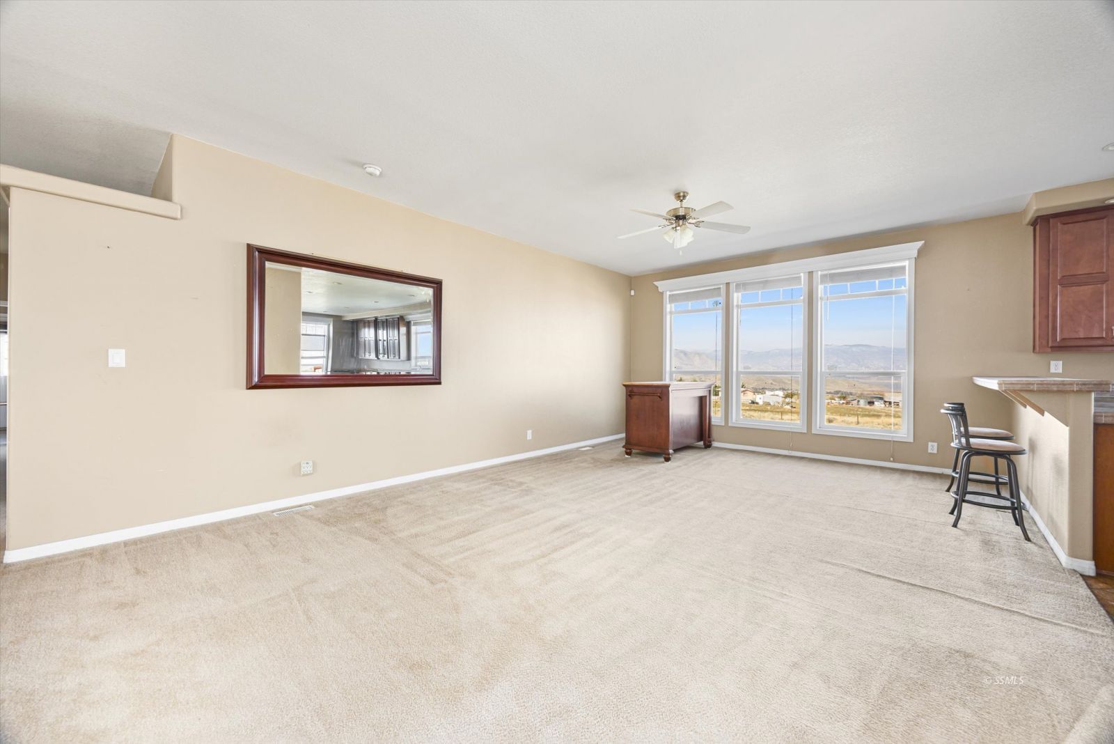 4131 Brooks Road Weldon, CA 93283 - Photo 12 of 49 a big room with windows and a chandelier fan