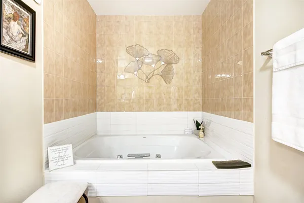 a bathroom with a bathtub and shower