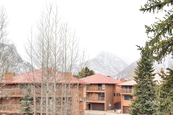 a view of house with yard and sitting area
