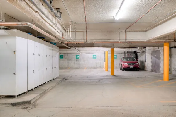 a view of parking garage with cars