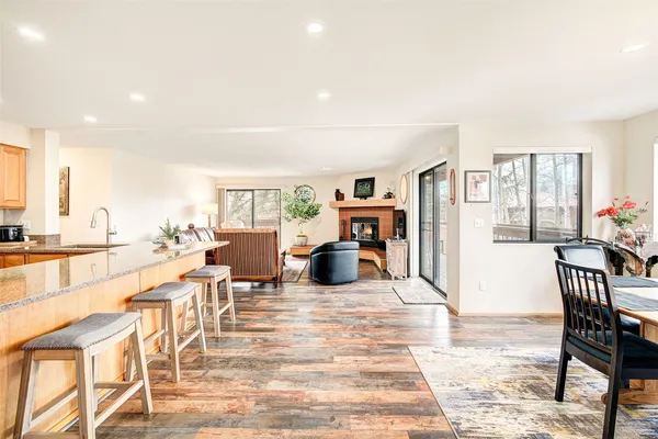 a living room with furniture a dining table and chairs with outer view