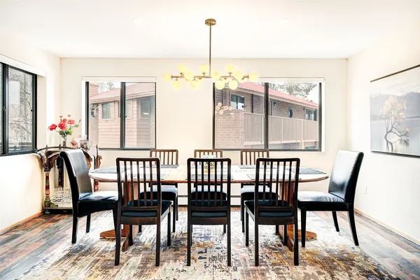 a view of a dining room with furniture window and wooden floor