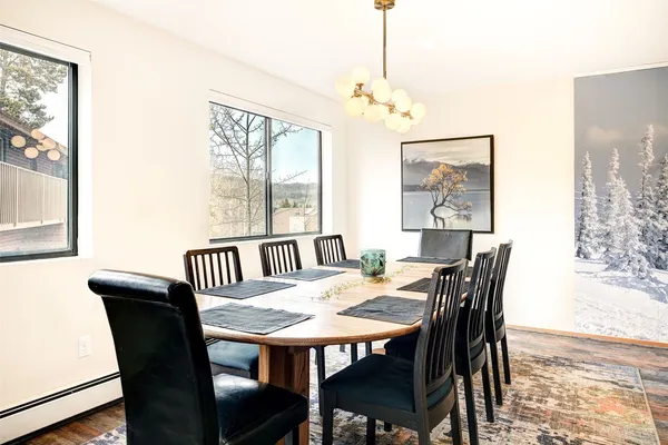 a view of a dining room with furniture window and wooden floor