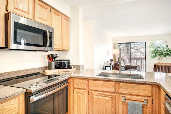 a kitchen with a stove and a microwave