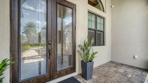a view of a glass door and a window
