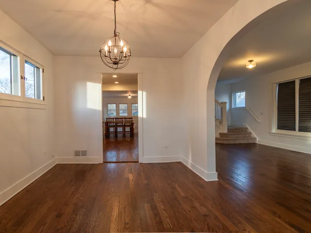 a view of livingroom with hardwood floor and kitchen view