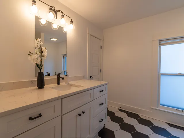 a bathroom with a sink and a mirror