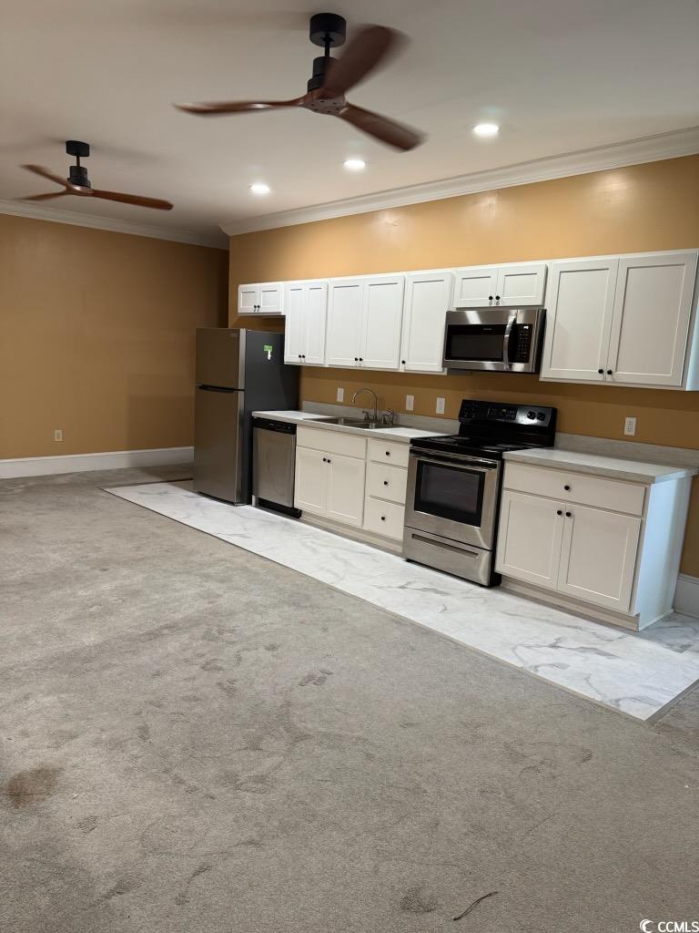 801 Front Street, Unit APARTMENT C Georgetown, SC 29440 - Photo 2 of 8 Kitchen with crown molding, appliances with stainl