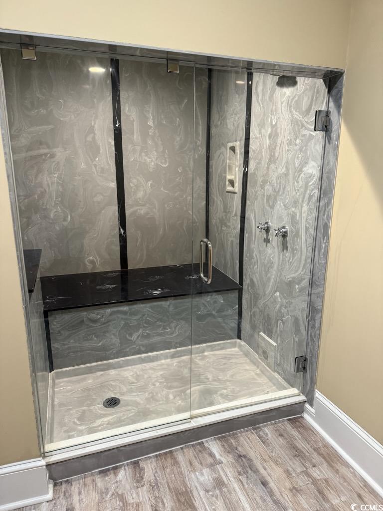 801 Front Street, Unit APARTMENT C Georgetown, SC 29440 - Photo 4 of 8 Full bathroom with a marble finish shower and wood