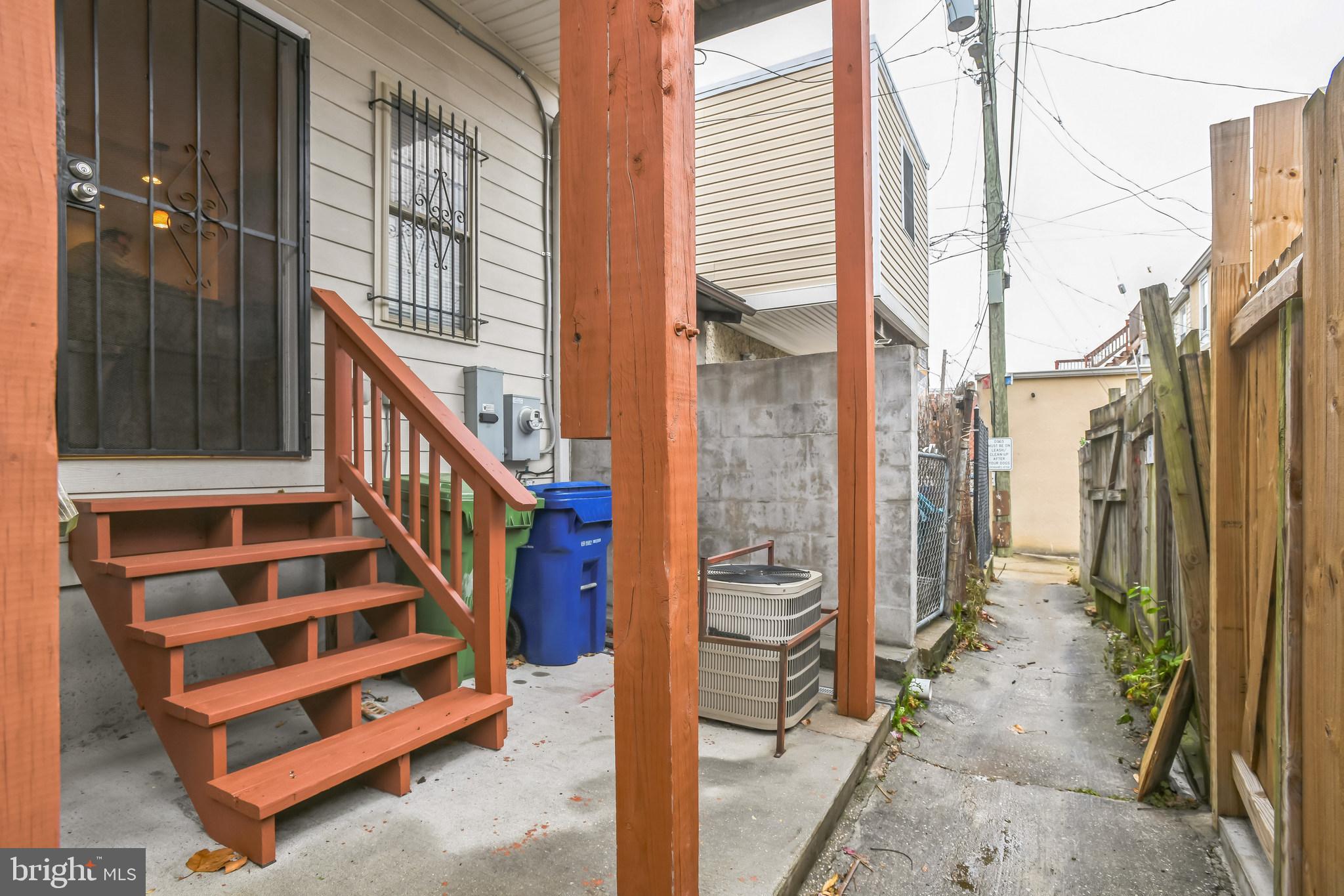129 North Duncan Street Baltimore, MD 21231 - Photo 13 of 34 a view of a balcony a door and a large window