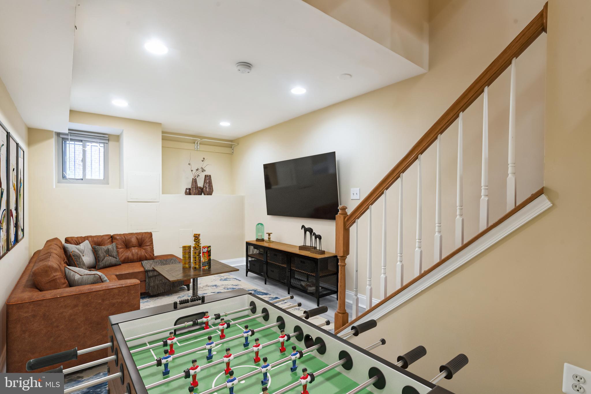 129 North Duncan Street Baltimore, MD 21231 - Photo 16 of 34 a living room with furniture and a flat screen tv