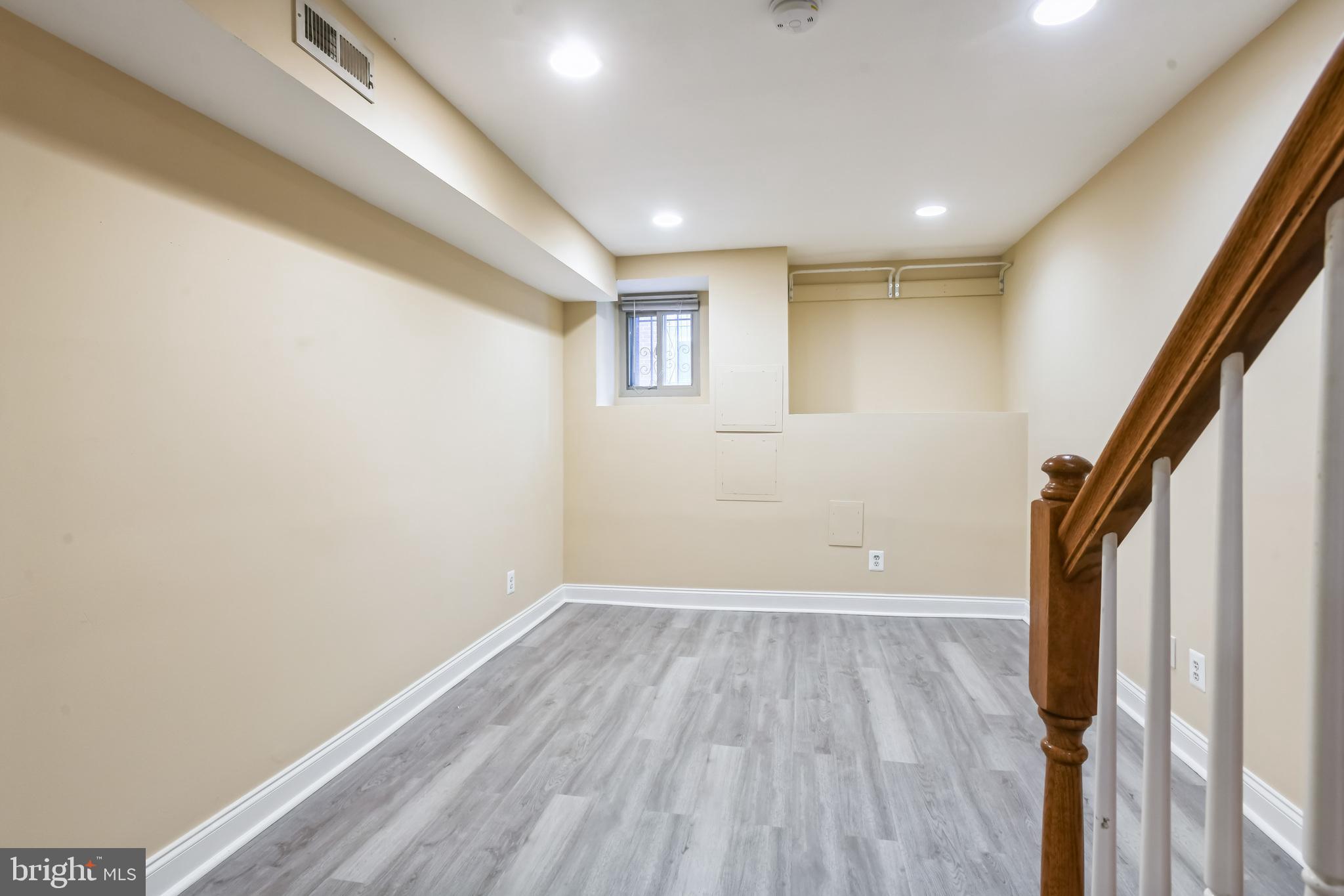 129 North Duncan Street Baltimore, MD 21231 - Photo 18 of 34 a view of empty room with wooden floor and fan