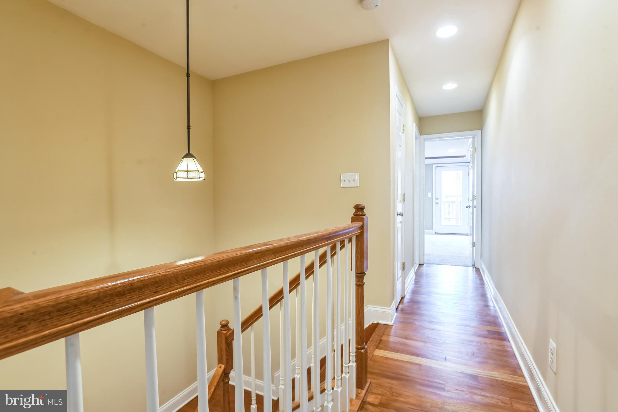 129 North Duncan Street Baltimore, MD 21231 - Photo 22 of 34 a view of a hallway with wooden floor