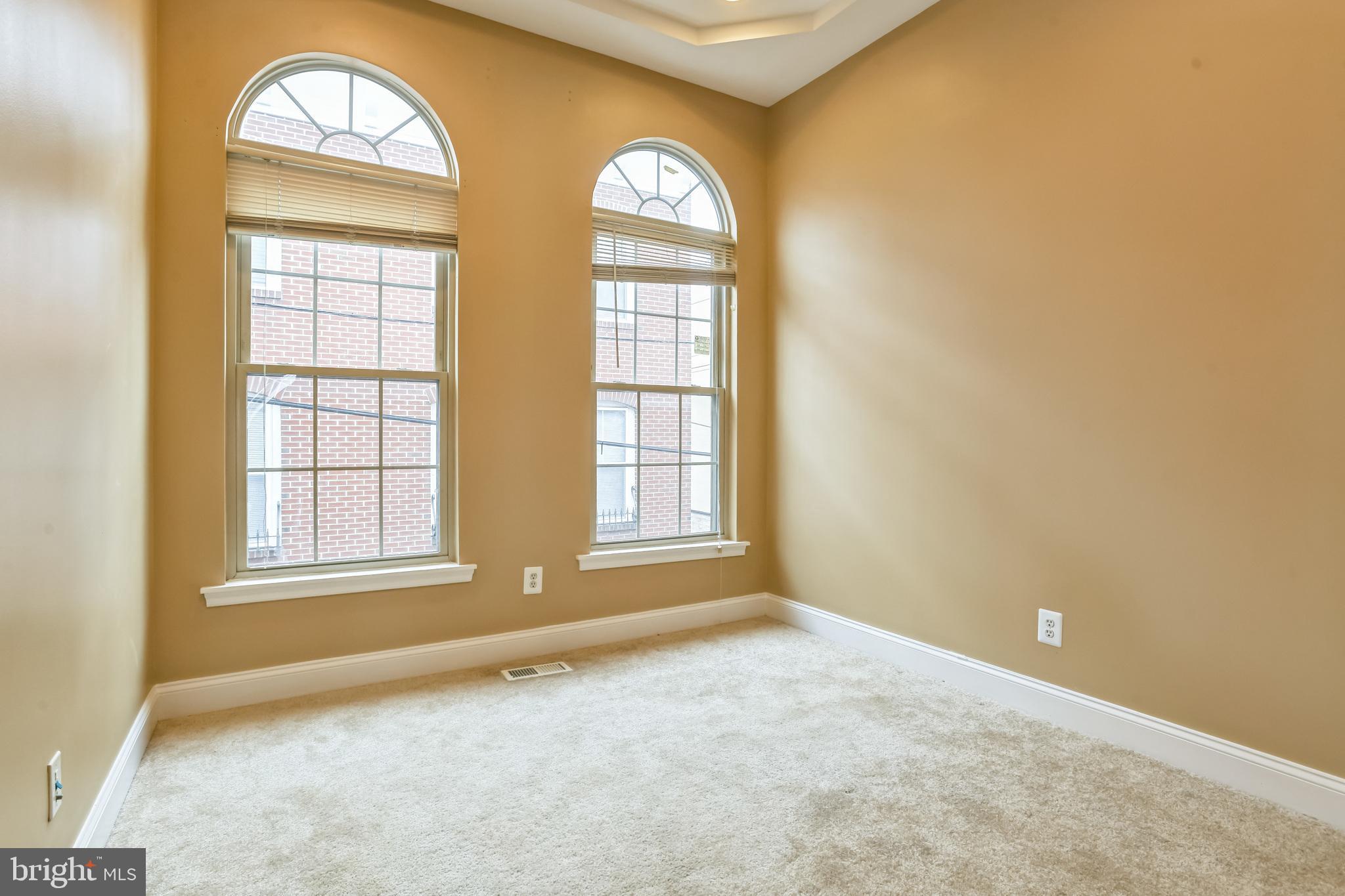 129 North Duncan Street Baltimore, MD 21231 - Photo 24 of 34 an empty room with windows mirror and window