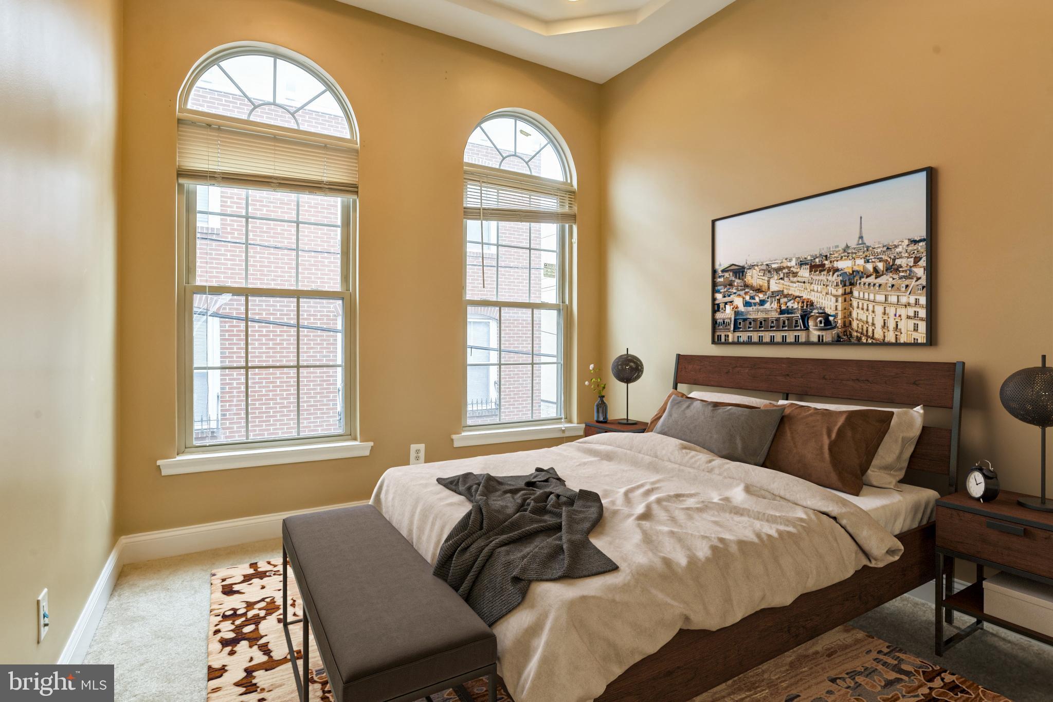 129 North Duncan Street Baltimore, MD 21231 - Photo 25 of 34 a bedroom with a bed and a large window