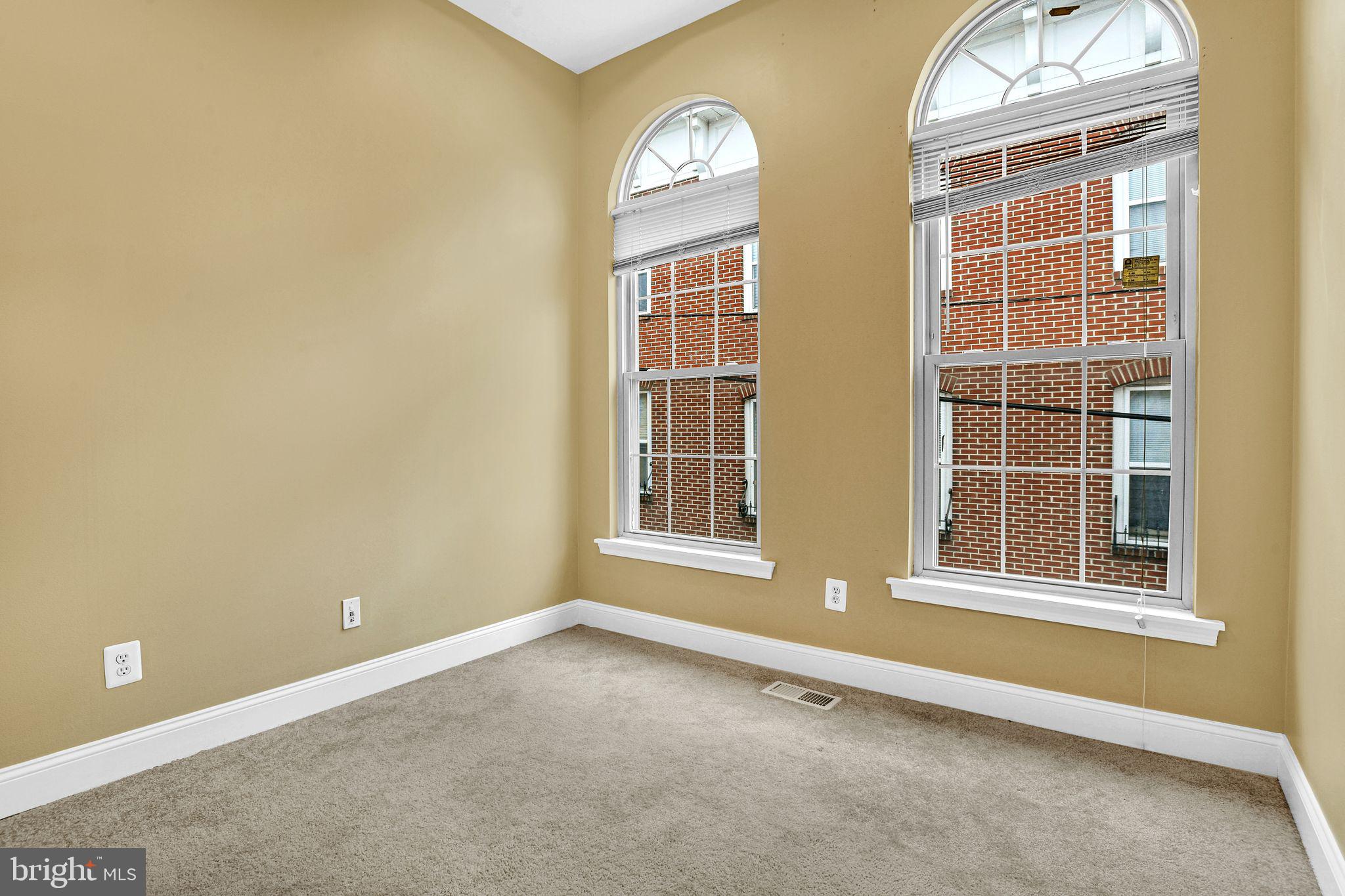 129 North Duncan Street Baltimore, MD 21231 - Photo 26 of 34 a view of an empty room with windows