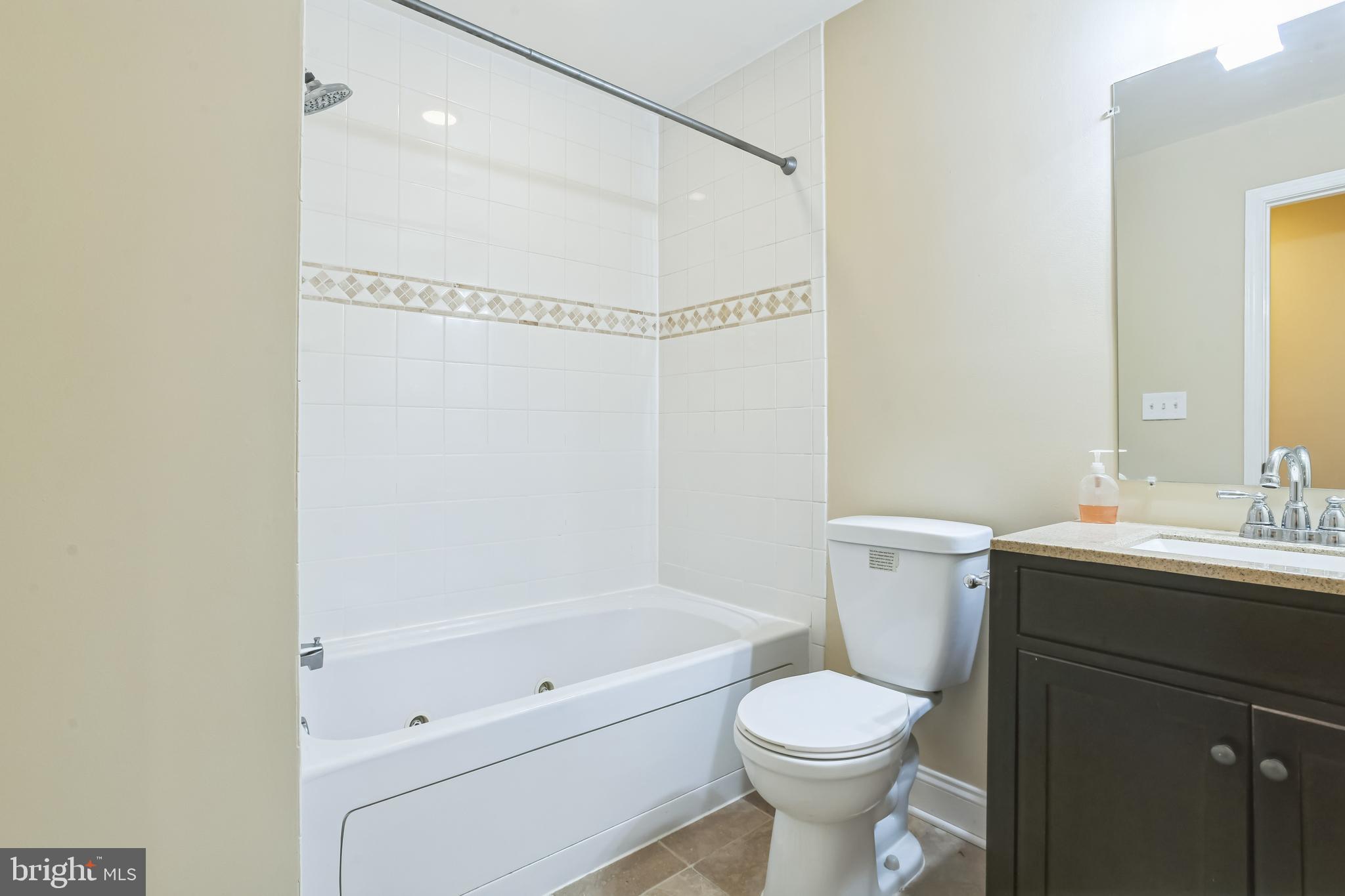 129 North Duncan Street Baltimore, MD 21231 - Photo 27 of 34 a bathroom with a sink toilet and shower
