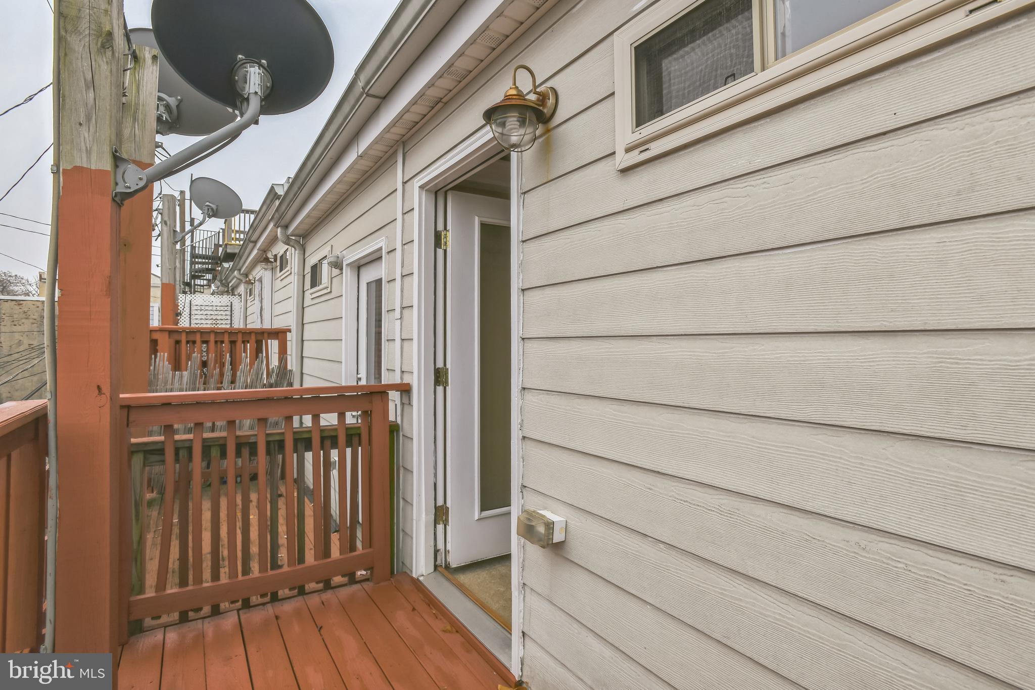 129 North Duncan Street Baltimore, MD 21231 - Photo 33 of 34 a view of a house with a balcony